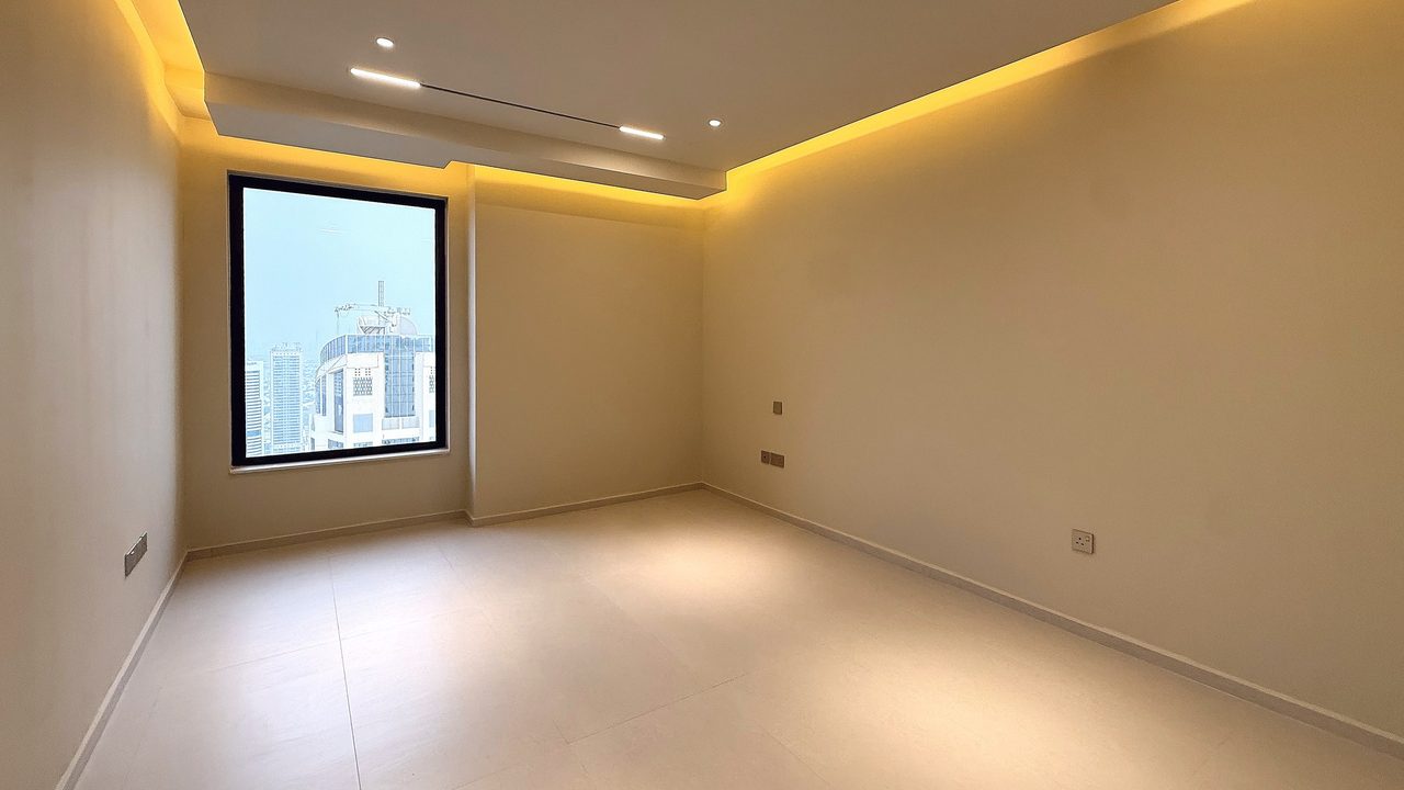 Bedroom with city view, unfurnished, as photographed
