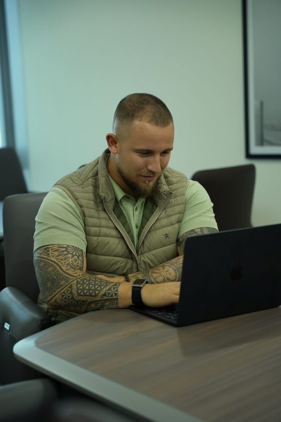 Matthew Clarke Smith, founder of Vantage Studios, working at a laptop